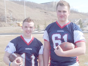 Logan Clow/R-G
Peace River Pioneers graduates Curt Craddock (left) and Kruise Hofferd (right), pictured at Glenmary Field on Monday April 22, will be representing the community at the Football Alberta High School All-Star Senior Bowl game on May 20 at McMahon Stadium in Calgary. The Pioneers graduates cracked the 40-man roster for the north squad and will face off against the south (players from the Calgary area) squad.