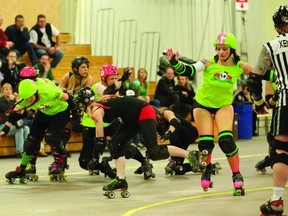 Airdrie, Alta. - Members of the Rocky View Rollers compete against the Gas City Regulators in the association's first bout of the year, March 16 in Medicine