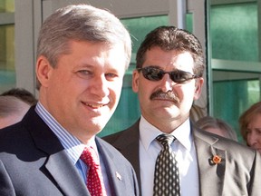 RCMP Superintendent Bruno Saccomani, shown here with Prime Minister Stephen Harper, has been named Canada's ambassador to Jordan after serving as the head of Harper's security detail.