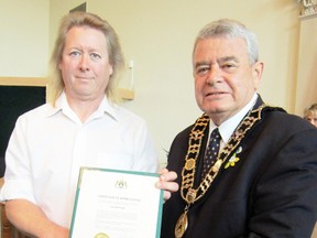 MONTE SONNENBERG Times-Reformer
Norfolk Mayor Dennis Travale, right, presented Vince McGregor of Booth's Harbour with a citation Tuesday for timely interventions during two recent medical emergencies at the St. Williams Community Centre.