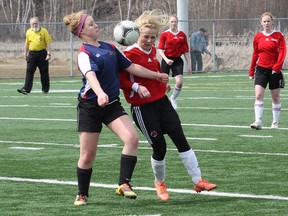 Emily Brownlee, left, of Bishop Alexander Carter, and Courtney Ceccarelli, of St. Charles College, battle for possession of the ball during girls high school soccer action at the James Jerome Sports Complex on Tuesday. St. Charles won 2-0. JOHN LAPPA/THE SUDBURY STAR/QMI AGENCY