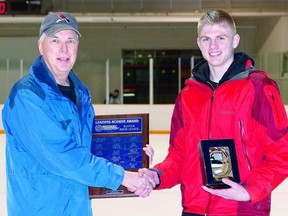 Contributed photo
Stratford Rotary Hockey bantam-midget division convener Eric McLeod presents scoring champion Mitch McFadden with his award prior to the championship games a month ago.