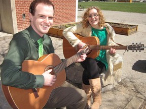 Earth Day at Delhi District Secondary School was set aside Monday for the dedication of a unique learning space on the school’s east side. Strumming soothing chords to mark the occasion were geography teacher Justin Murrell and Grade 10 student Christina Cromwell. (MONTE SONNENBERG Delhi News-Record)