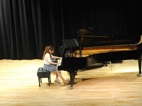 Emily App, from Watford, plays Solfegietto, C. P. E. Bach on the piano at the Lambton County Musical Festival Tuesday. BLAIR TATE/FOR THE OBSERVER/QMI AGENCY