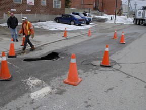 A deep sink hole appeared at the intersection of Prospect Ave. and Water Lane when the truck in the background approached the corner.