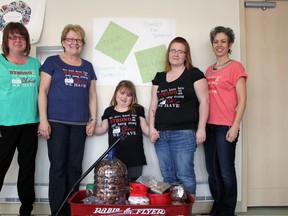 Family Health Team manager Tammy Tallon, RN certified diabetes educator Susan Clarke, Haileigh Bond, Kayli Bond and program assistant Marcella Yusko  with Haileigh’s wagon filled with pennies. Photo by Dawn Lalonde/Mid-North Monitor/QMI Agency