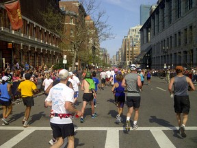 Runners in the 2012 Boston Marathon on Boylston St., about 300 yards from the finish line where the bomb exploded ruing this year's running of the race.