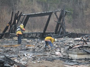 On Wednesday investigators search for the cause of a fire that destroyed the model home of a Pinvest Homes development on Willow Street in Paris. County of Brant firefighters responded to the call at 5:30 a.m. on Tuesday, April 23, 2013. MICHAEL PEELING/The Paris Star/QMI Agency