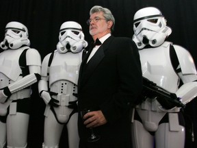 Star Wars creator George Lucas poses with Storm Troopers, characters in the Star Wars movies, during a gala in this Oct. 22, 2005 file photograph. Reuters file photo