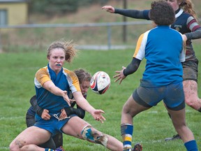 BRIAN THOMPSON, The Expositor

BCI's Brooke Newsome passes the ball to a teammate as she gets tackled by an Assumption defender during the opening game of the high school senior girls rugby season on Wednesday at Assumption College.