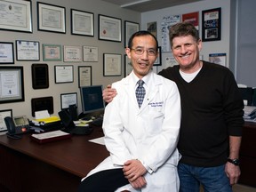 Dr. Joseph Chin, chief of surgical oncology at London Health Sciences Centre removed cancer from Brian Danter's prostate using a world first procedure.  They were photographed in London on Wednesday.