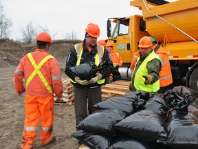 Trent Hills public works crews prepare sandbags at a sand pit on County Road 35 in expectation of flooding over the next week as flood waters flowing from the north combine with heavy rains in the area.