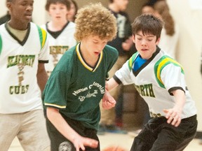 Kristopher Sepers, of Huron Centennial Public School dribbles past players from Seaforth Public, including Orlando Campbell, Adam Henry and Jared Smith.