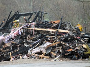 On Wednesday investigators search for the cause of a fire that destroyed the model home of a Pinevest Homes development on Willow Street in Paris early Tuesday morning. The Ontario Fire Marshal's office is calling the fire a case of arson. MICHAEL PEELING/The Paris Star/QMI Agency