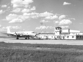 SOUTH PEACE REGIONAL ARCHIVES
A Canadian Pacific Airlines DC-6B on the tarmac at the Grande Prairie airport in the mid-1960s.