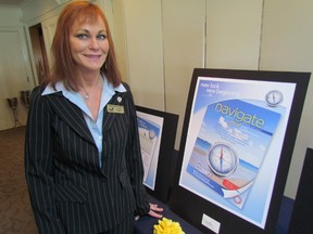 Marlene Wood, manager of Tourism Sarnia Lambton, stands next to a poster of the cover of its new tourism publication. The organization hosted a Lambton County Tourism Summit Thursday in Camlachie. (PAUL MORDEN/THE OBSERVER/QMI AGENCY)