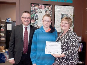 Brenden Martell (m) was presented the April Chantal Bérubé Memorial Youth of the Month Award from Jo-Anne (r) and Camille Bérubé (l) at the Chantal Bérubé Community Youth Centre on Apr. 24. ADAM HODNOTT/BEAUMONT NEWS