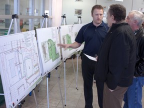 JJ Straker, director of parks and facilities with the Town of Beaumont, speaks with a Beaumont resident during the Dansereau Community Park Project public open house at the S&D Aquafit Centre on Wednesday, April 24. ADAM HODNETT/BEAUMONT NEWS