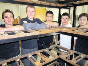 MONTE SONNENBERG Simcoe Reformer
The distinctive shelving units that will soon be installed at the Burning Kiln Winery north of Turkey Point were recently made by woodworking students at Holy Trinity Catholic High School in Simcoe. Among those working on the project were, from left, Mark Yarek of Simcoe, Mark Duesling of Simcoe, Phil DaSilva of Simcoe, Austin Stewart of Simcoe and Tyler Huitema of Jarvis.