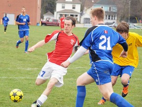 DANIEL R. PEARCE Simcoe Reformer
Austin Logan of the Waterford Wolves kicks the ball at the Simcoe Composite School net on Thursday afternoon during his team's 3-0 defeat of the host Sabres. Trying to stop him is Lucas Martin (21) of the Sabres.