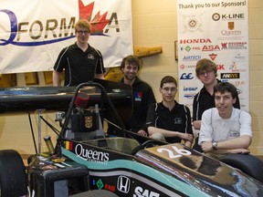 Matt Ladouceur, Lee McCay, Johan Degrigny, James Hynes and Daniel Kelly, members of the Queen’s University Formula SAE Design and Race team, pose with their recently unveiled 2013 small formula race car, the “Q13”, at a public ceremony held at Beamish-Munro Hall in the Integrated Learning Centre on Thursday.
Julia McKay For The Whig Standard