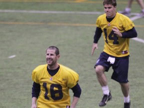 Winnipeg Blue Bombers quarterbacks #16 Max Hall and #14 Chase Clement during practice at the University of Manitoba in Winnipeg, Wednesday, April 24, 2013. (Chris Procaylo/Winnipeg Sun/QMI Agency)