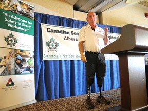 Adam Jackson/Daily Herald-Tribune
Paul Hebert, who survived a 14,400-volt powerline workplace accident 24 years ago, speaks at the North American Occupational Safety and Health conference at Paradise Inn and Conference Centre Thursday.