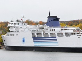 The Owen Sound Transportation Company's ferry the Chi-Cheemaun sits tied up across from a pair of tugboats in the Owen Sound inner harbour on Monday October 15, 2012. The ferry made her final run of the season with a load of passengers from Tobermory to Owen Sound on Monday, despite high winds and rain the boat made the trip in good time. She will stay in Owen Sound for maintenance over the winter until she resumes her duties in the spring ferrying cars and people between Tobermory and South Baymouth on Maintoulin Island.--The Sun Times\JAMES MASTERS\QMI Agency.