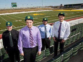 New U of A Golden Bear football recruits Matt Clark, left to right, Zak Palek, Samuel Rybiak, and Tak Landry pose for a photo during a media availability at Foote Field in Edmonton, Alta. on Thursday, April 25, 2013. Amber Bracken/QMI Agency