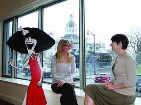 Kim Gascoigne, fundraising coordinator of Gilda’s Club of Southeastern Ontario, and Belinda Vandersluis, executive director, sit in the window overlooking Confederation Park in the organization’s new clubhouse at 6a Clarence St.     ROB MOOY - KINGSTON THIS WEEK