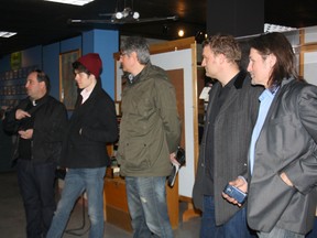 The Colony producer Paul Barkin, left, actor Atticus Mitchell, writers Svet Rouskov and Patrick Tarr, and actor John Tench, tour the Canadian Forces Museum of Aerospace Defence at 22 Wing CFB North Bay, Friday, April 26, 2013. The crewmembers from the film shot at the underground complex last year returned to the city to mark the premiere of the film Friday night.