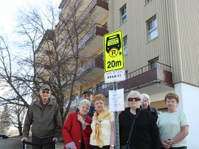 A group of seniors living at the Wanner Towers on Douglas Street gathered Friday around the bus stop outside their building that's slated to be removed at the end of the month.