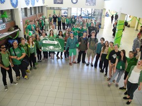 Students at Brantford Collegiate Institute formed a living green ribbon Friday, just one of many events held at the school to educate students about organ donation. A similar event will be held Sunday at 7 p.m. in Harmony Square. (Michelle Ruby Brantford Expositor)