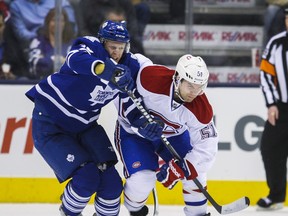Maple Leafs’ Carl Gunnarsson and Canadiens’ David Desharnais give chase earlier this month. If the teams meet in the playoffs, Toronto players will be “rusty” with their French. (Ernest Doroszuk/Toronto Sun)