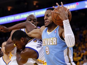Nuggets forward Andre Iguodala takes a rebound from Warriors forward Harrison Barnes during Game 3 of their NBA Western Conference quarterfinal series at Oracle Arena in Oakland, April 26, 2013. (ROBERT GALBRAITH/Reuters)
