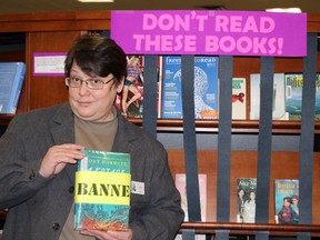 Carolyn Goolsby, Fort McMurray Public Library’s director, shows off some books that have historically been banned from bookshelves, which were on display at FMPL as part of Freedom to Read week.