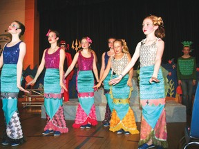 From left, Naomi Allan, Delaney Dickson, Emma Parsons, Shayna Leischow, Gracie Kantola and Lauren Gray practice their song for Lakewood’s production of the Little Mermaid which continues on stage Friday and Saturday. The six girls are Ariel’s mersisters.
GRACE PROTOPAPAS/Daily Miner and News