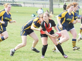 DANIEL R. PEARCE Simcoe Reformer
Ricki Hearn of the Waterford Wolves girls rugby team moves the ball in her team's 29-0 win over the visiting Delhi Raiders on Friday. Both teams say they are rebuilding.