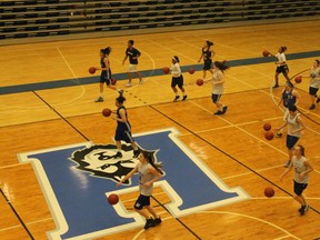 Players at the Keyano College Huskies women’s basketball spring identification camp participate in a dribbling drill Saturday afternoon. TREVOR HOWLETT/TODAY STAFF