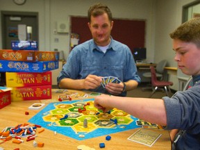 Dave Hoff and son Wilson Close, 14, are trying to engage kids and their parents in games that involve strategy and imagination rather than fast-twitch muscles. (MIKE HENSEN, The London Free Press)