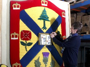 Carolyn Pickering does some needlework repairs to the Queen's crest. The first time she's done that since creating it 40 years ago.
Ian MacAlpine The Whig-Standard