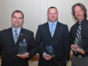 The Expositor's Hugo Rodrigues (left), Brian Smiley and Brian Thompson pose with their Ontario Newspaper Awards. (Photo by DONNA THOMPSON)