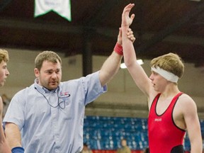 Kingston's TJ Taylor has his arm raised by the referee after winning one of his matches Saturday on the way to the provincial bantam wrestling title during the Ontario Bantam Championships and Novice/Kids Festival, at the Memorial Centre.
Julia McKay For The Whig Standard