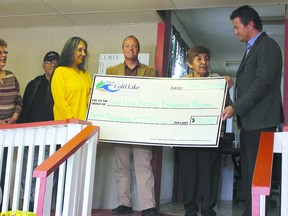 THERESA SERAPHIM/COLD LAKE SUN
(From left) Cold Lake Native Friendship Centre (CLNFC) board secretary Jorunn McEvoy, lifetime elder Jonas Andrew, board president Lynda Minoose, city councillor Kelvin Plain, CLNFC executive director Agnes Gendron and Mayor Craig Copeland celebrate the city giving $50,000 towards a new CLNFC facility. So far, the centre has raised $143,000 (includ8ing the city’s donation) of the $800,000 cost of the new building, which will include a common area, office space, a new classroom and potentially an area for a men’s shelter, as there is currently none in the area. The city’s donation is being held in a restricted account and will be transferred to the CLNFC upon breaking ground for the new facility.