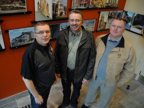 Allan Avis celebrates the grand opening of his West Street building with the guys who built it - Clarence Liestra and Dave Thorpe of Westhoek Construction.