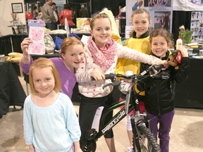 The Kincardine Skating Club’s Annual Home and Garden Show was held at the Davidson Centre in Kincardine on May 27-8, 2013. In addition to the vendor displays related to home and/or garden improvements, there was also a fundraising raffle held for the skating club. Club members (L-R) Ava Grattl, Ella Grattl, Hannah Grattl, Aubrey Alers and Cameron Kuntz showcase a number of the prizes available in the raffle, including a Supercycle compliments of John Satosek and Canadian Tire Kincardine. (JOHN F. ADAMS/KINCARDINE NEWS FREELANCE)