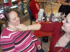 Karen McInnes gets her make-up done by Rebecca Phillips at Shoppers Drug Mart Kincardine on April 27, 2013 for the Community Living "Girls Night Out" Fundraiser. The $15 ticket provided a make-up session, a professional photograph by Steve Small from Picture This Imaging, and a drink at the Bruce Steakhouse. (JULIA HERRICK/KINCARDINE NEWS FREELANCE)