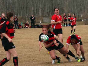 The Salisbury Sabres girls rugby team takes on Jasper Place during the Lynn Davies High School Rugby Tournament in Sherwood Park on Saturday, something that will become a more regular occurrence now that the two Edmonton-area leagues have joined forces. Photo by Shane Jones/Sherwood Park News/QMI Agency