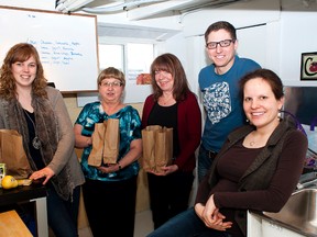 TAYLOR WEAVER HIGH RIVER TIMES
The majority of the Food for Thought team shows where the magic happens in the kitchen where all of the lunches are prepared. Pamela Rodriguez, Diane Townsend and Penni Tebbs are among some of the program’s drivers and Tim Curtis and his wife Suvi-Tuulia Lorenz-Curtis handle the paperwork and lunch preparation.