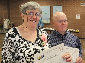 H'art school's Lori Allum, left, and Kevin Beauregard have completed five years of study at Queen's University in a special program that allows adults with intellectual disabilities study alongside the university's students.
Michael Lea The Whig-Standard
